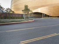 a building with a curved top that looks like something in a big city or town