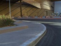 a man rides a skateboard through an intersection in the sun while people walk around