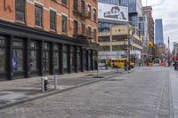 the bricked streets with tall buildings have posters on them as a place to be photographed