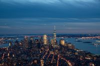 new york city and hudson river at twilight from the empire building looking down onto lower manhattan