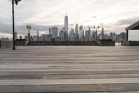 the skyline is visible in the background from the pier in lower manhattan, new york