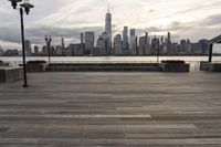 the skyline is visible in the background from the pier in lower manhattan, new york