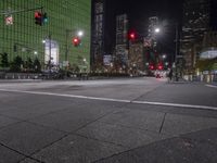 a view of the street at night as it is empty of people and vehicles to cross