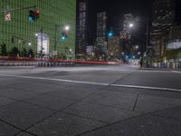 a view of the street at night as it is empty of people and vehicles to cross