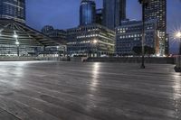 a view of new york city skyline at night from pier on the hudson river side