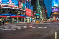 a busy city with pedestrians walking through the street at night time in times square, new york city