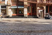 the street is quiet and empty in this city, as well as the bicycles outside