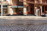 the street is quiet and empty in this city, as well as the bicycles outside