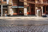 the street is quiet and empty in this city, as well as the bicycles outside