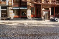 the street is quiet and empty in this city, as well as the bicycles outside