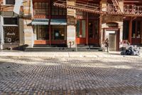 the street is quiet and empty in this city, as well as the bicycles outside