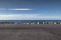 New Zealand's Azure Beach: Waves Along the Coastal Road