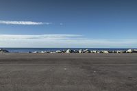 New Zealand's Azure Beach: Waves Along the Coastal Road