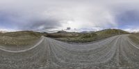 a 360 - panorama image of the road running through the countryside in the middle of the day