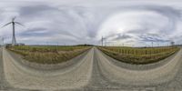 three 360 degrees degrees degree view of windmills in the countryside and empty roads with dirt roads