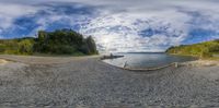 an image of a beautiful lake and sky with clouds on it and fish eye lens