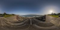 a fish eye picture of a beach and the ocean from a viewpoint point on a camera