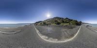 a panoramic view of some road and an island in the middle of it