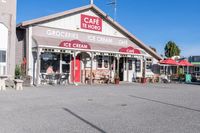 a building with two large windows that say the crockie cream shop on the second floor