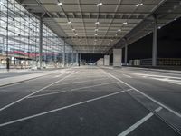 a deserted parking lot covered with lots of windows at night or night time is empty