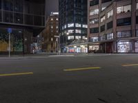 a corner in the city with no one in it at night time and no cars in it