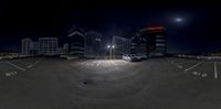 a 360 - view picture taken at night with the city lights shining brightly behind it