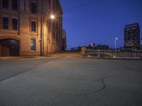 a city street filled with lots of light at night to produce the illusion of a deserted road