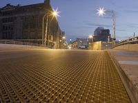 a metal grate is shown at night on the sidewalk in this city street scene