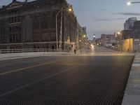 a metal grate is shown at night on the sidewalk in this city street scene