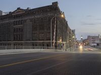 a metal grate is shown at night on the sidewalk in this city street scene