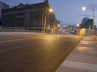 a metal grate is shown at night on the sidewalk in this city street scene