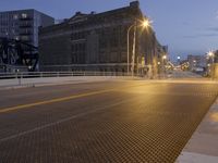 a metal grate is shown at night on the sidewalk in this city street scene