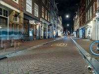 Night Cityscape in Amsterdam with Bicycle and Buildings