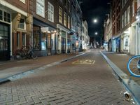 Night Cityscape in Amsterdam with Bicycle and Buildings