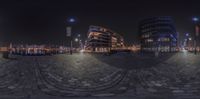 two circular images with a view of a city at night, taken from a fish eye