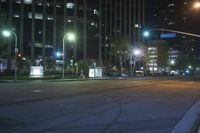 the city is lit up at night with street lights and no traffic signs on them