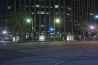 the city is lit up at night with street lights and no traffic signs on them