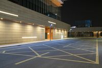 an empty street is empty at night with no people inside or around it in front of a building