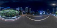 a 360 - view picture of a cityscape at night time as seen through the camera lens