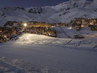 Night Landscape of Snow-Lit Ski Slopes in the Alps