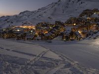 a view of the mountain village of an outdoor ski area on a very snowy day