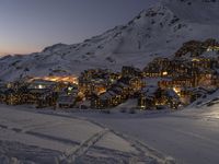 a view of the mountain village of an outdoor ski area on a very snowy day