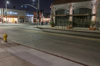 an image of the night time in town and street corner area with no people around