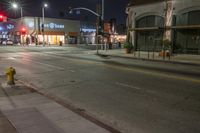 an image of the night time in town and street corner area with no people around