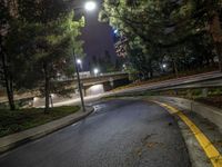 a night time photo of a street and a highway at night with a yellow stripe