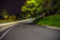 an extreme blurry image of a road at night, driving on the side of the road