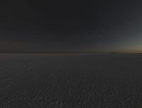 a photo of an empty field with no clouds in it, taken at sunrise time