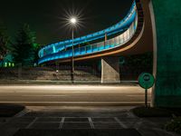 Night scene of the city under a low bridge in California