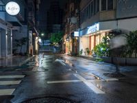 an empty wet city street at night during the day time with rain pouring on the ground