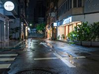 an empty wet city street at night during the day time with rain pouring on the ground